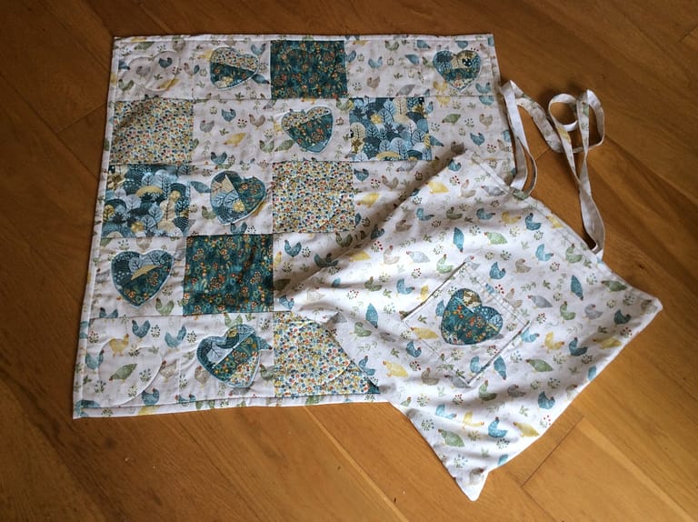 Baby quilt with matching bag.